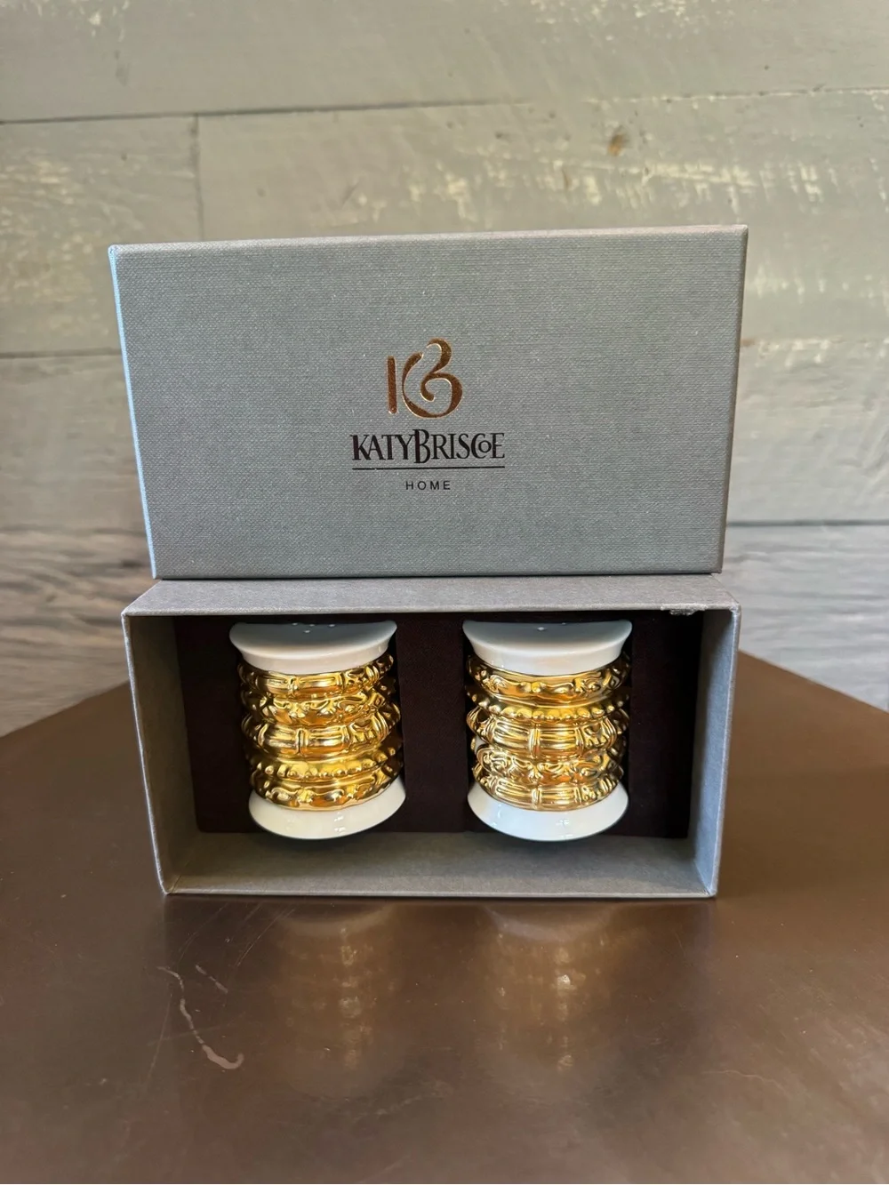 Katy Briscoe salt & pepper shakers made of bone white china with 24 carat gold.